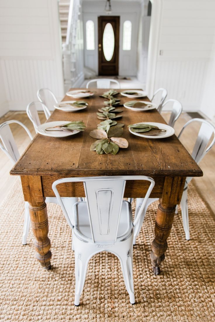 Farmhouse Dining Room with Rustic Wood Table and White Metal Chairs