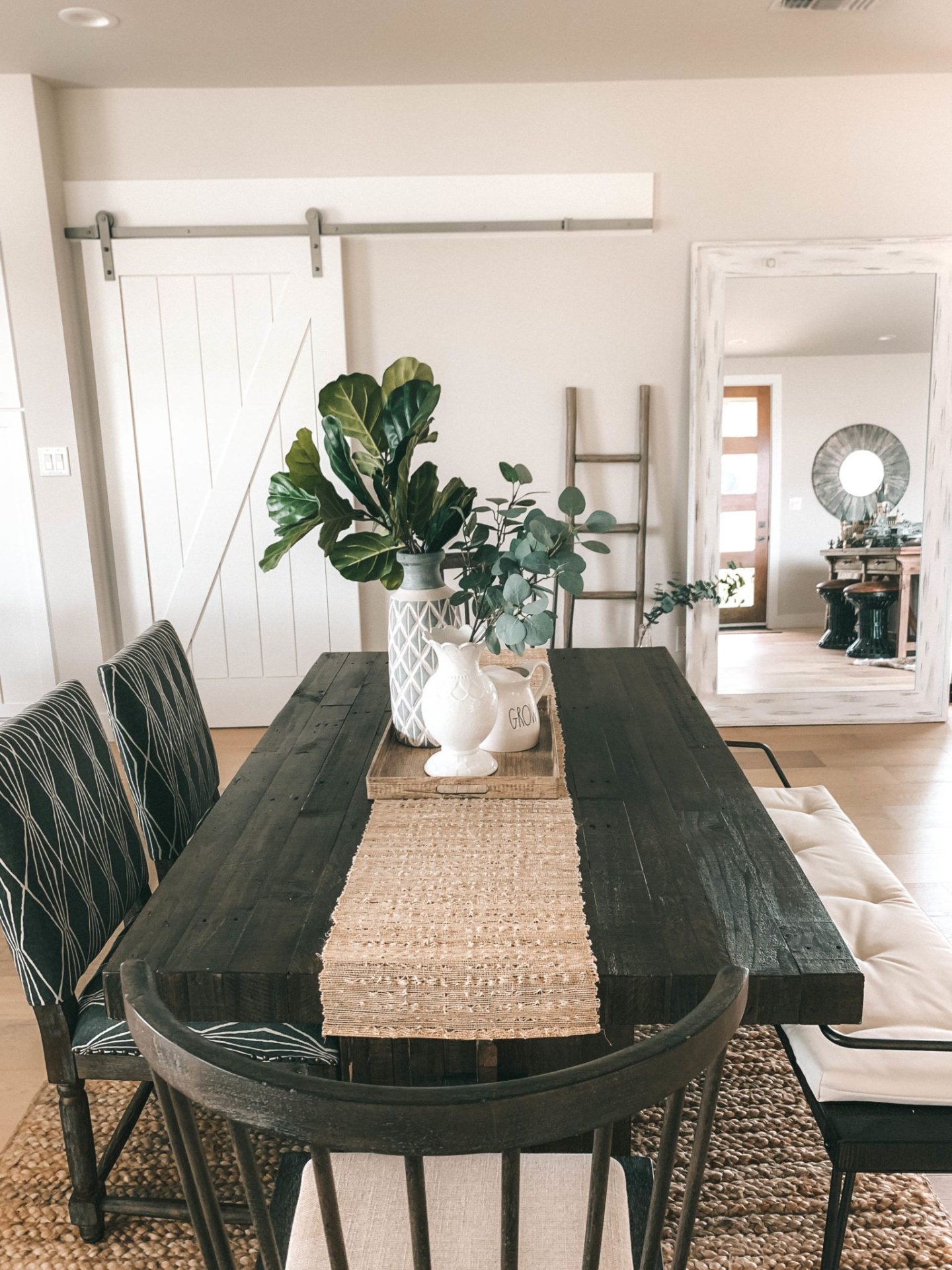 Modern farmhouse dining room with dark wood table