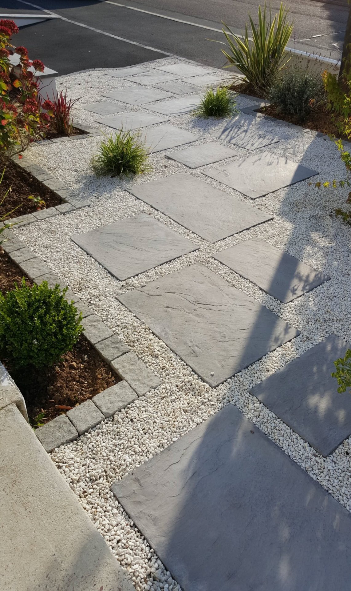 Modern Front Yard Pathway with Large Slate Pavers and Gravel Accents