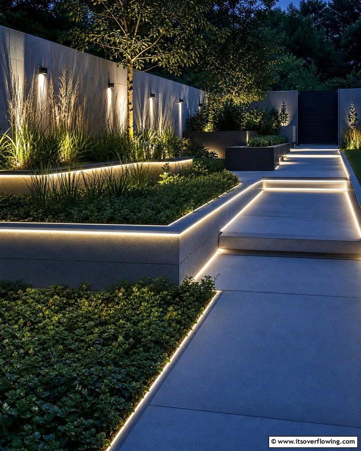 Modern Tiered Patio with Integrated LED Lighting and Lush Plantings