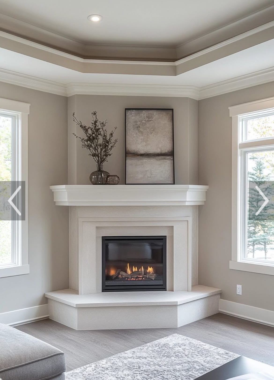 Contemporary Corner Fireplace with Neutral Mantel and Tray Ceiling